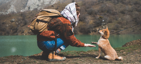 Woman hiking with dog