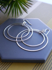 large-circle-statement-silver-earrings