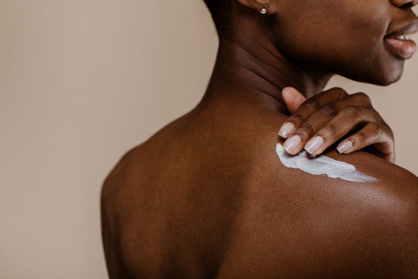 woman applying antioxidants to her skin