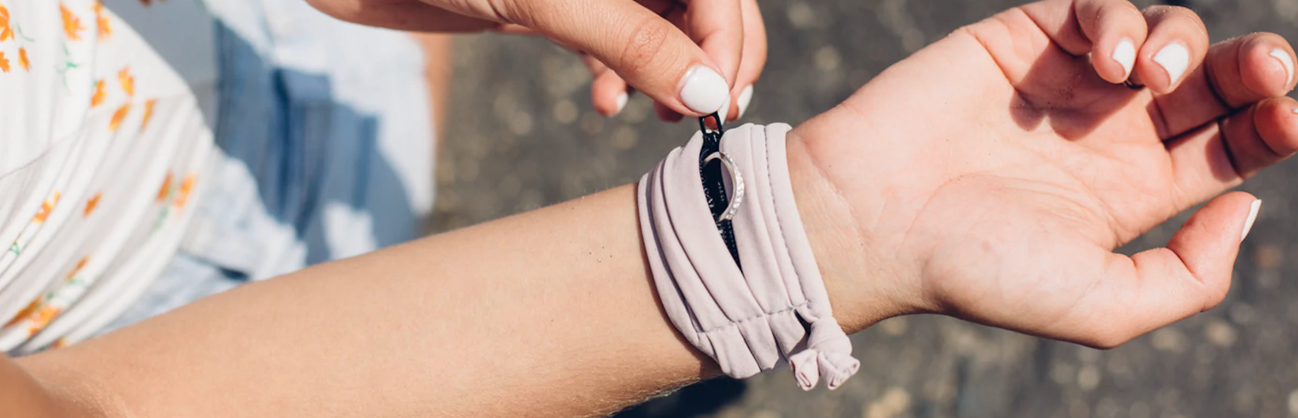 A arm band that looks similar to a scrunchie that has hidden pockets to hold things like rings, keys or anything little