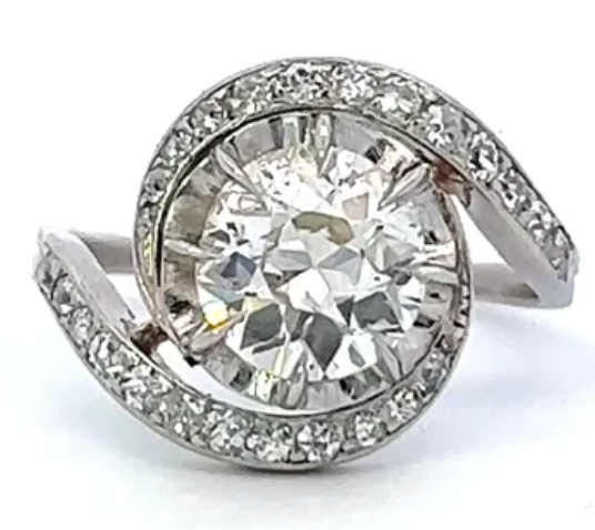1.37 carats Edwardian round brilliant cut diamond tourbillion swirl ring on a platinum setting