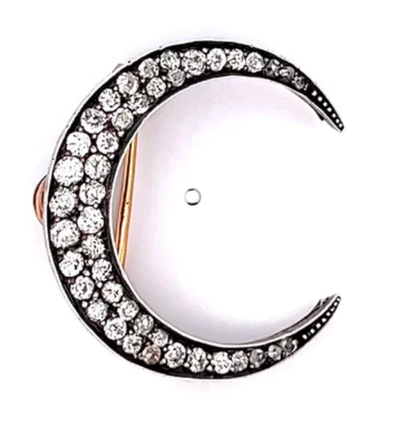 Victorian diamond silver rose gold crescent moon brooch on a gold setting