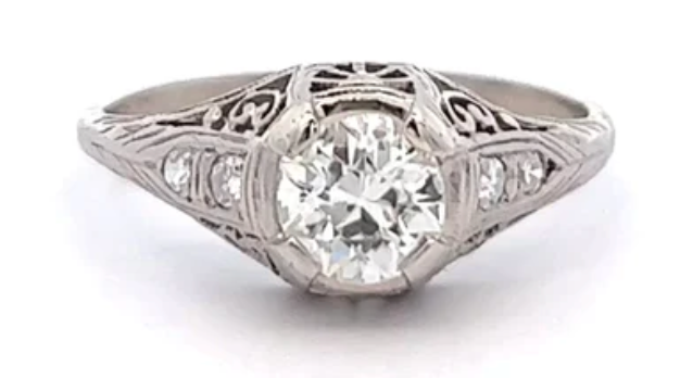 Edwardian 0.76 carat round brilliant cut diamond ring on a filigree platinum setting 