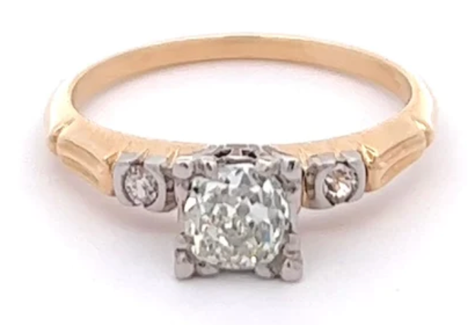 Retro 0.65 carats old mine cut diamond 14k yellow gold palladium three stone ring on a gold setting