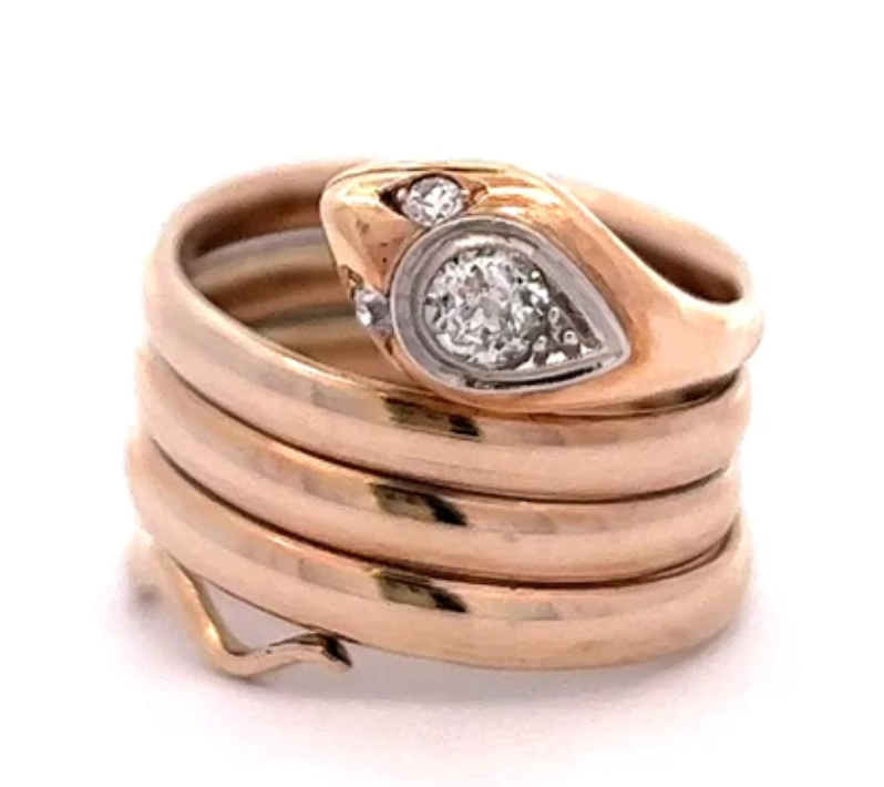 Victorian rose gold snake ring with three old european cut diamonds that weigh 0.25 carats