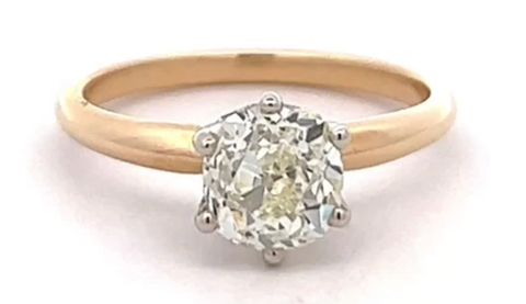 Edwardian 1.30 carats old mine cut diamond on a 14 karat yellow gold solitaire ring
