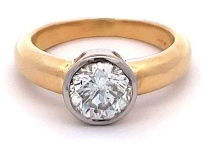 GIA 1.23 carats round brilliant cut diamond on a 14k gold bezel setting