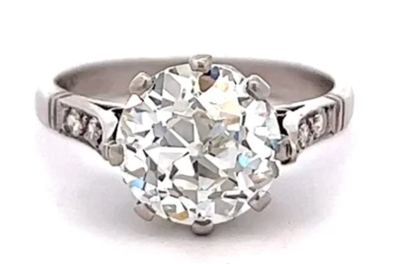 2.51 carats old european cut diamond ring accented by six single cut diamonds on a platinum setting