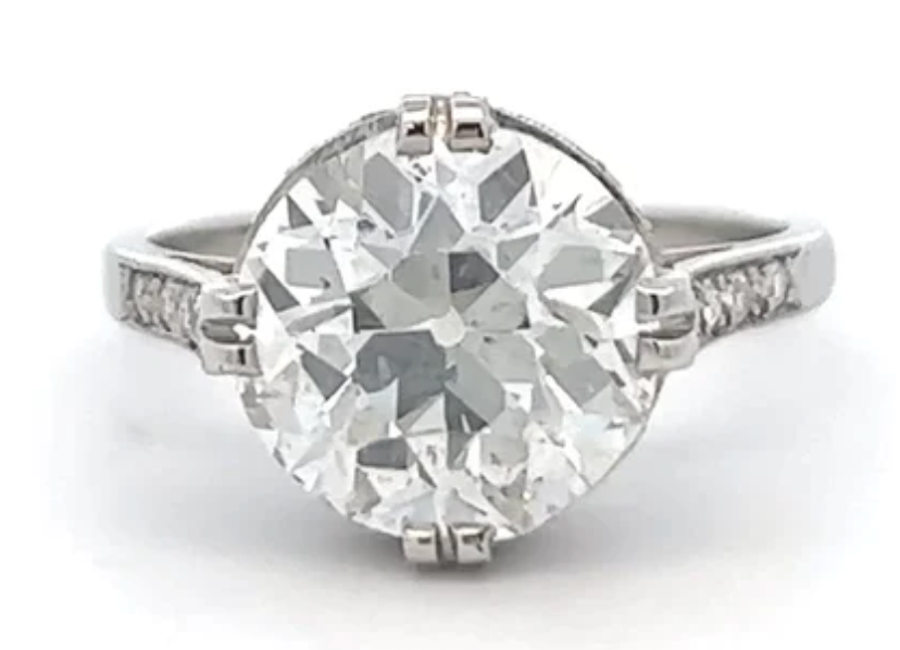 3.86 carats old european cut diamond accented 28 single cut diamonds on a platinum setting