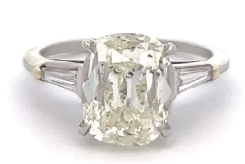 Vintage GIA 4 carat old mine cut diamond with two baguette cut diamonds on a white gold setting