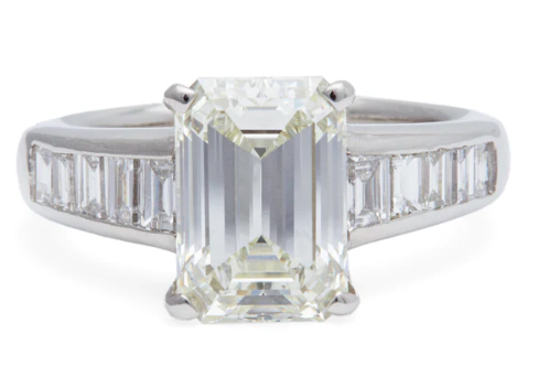 3.01 carat emerald cut diamond ring accented by 10 baguette diamonds on a platinum setting