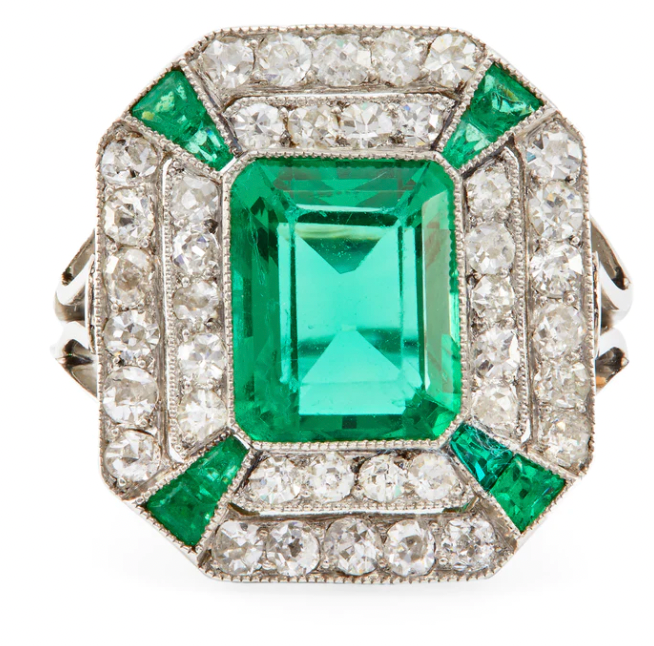 Art Deco synethetic emerald surrounded by diamonds on a platinum setting