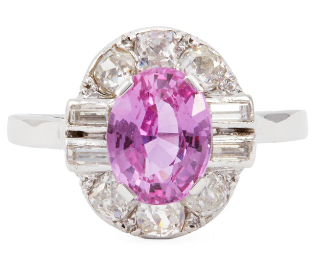 Vintage 2.49 carat pink sapphire in the center with diamonds all around on a 18k white gold setting