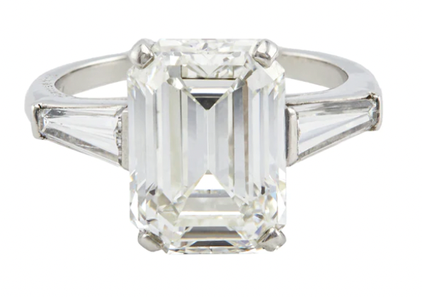 Cartier 4.63 carat emerald cut diamond accented by two tapered baguettes on a platinum setting