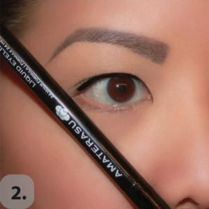 Take a straight edge such as the eyeliner or brush handle, and angle it against your nose, pointing towards the end of your eyebrow. This will be the angle of your wing. 
