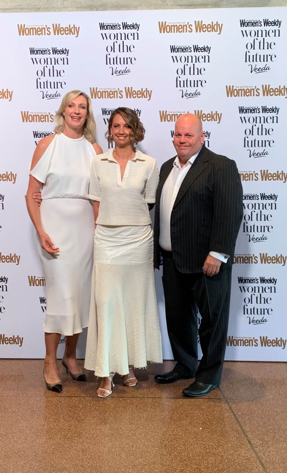 Women's Weekly Editor-In-Chief Nicole Byers, the event MC and TV icon Brooke Boney and Veeda CEO Adrian Forsyth share a red carpet snap.