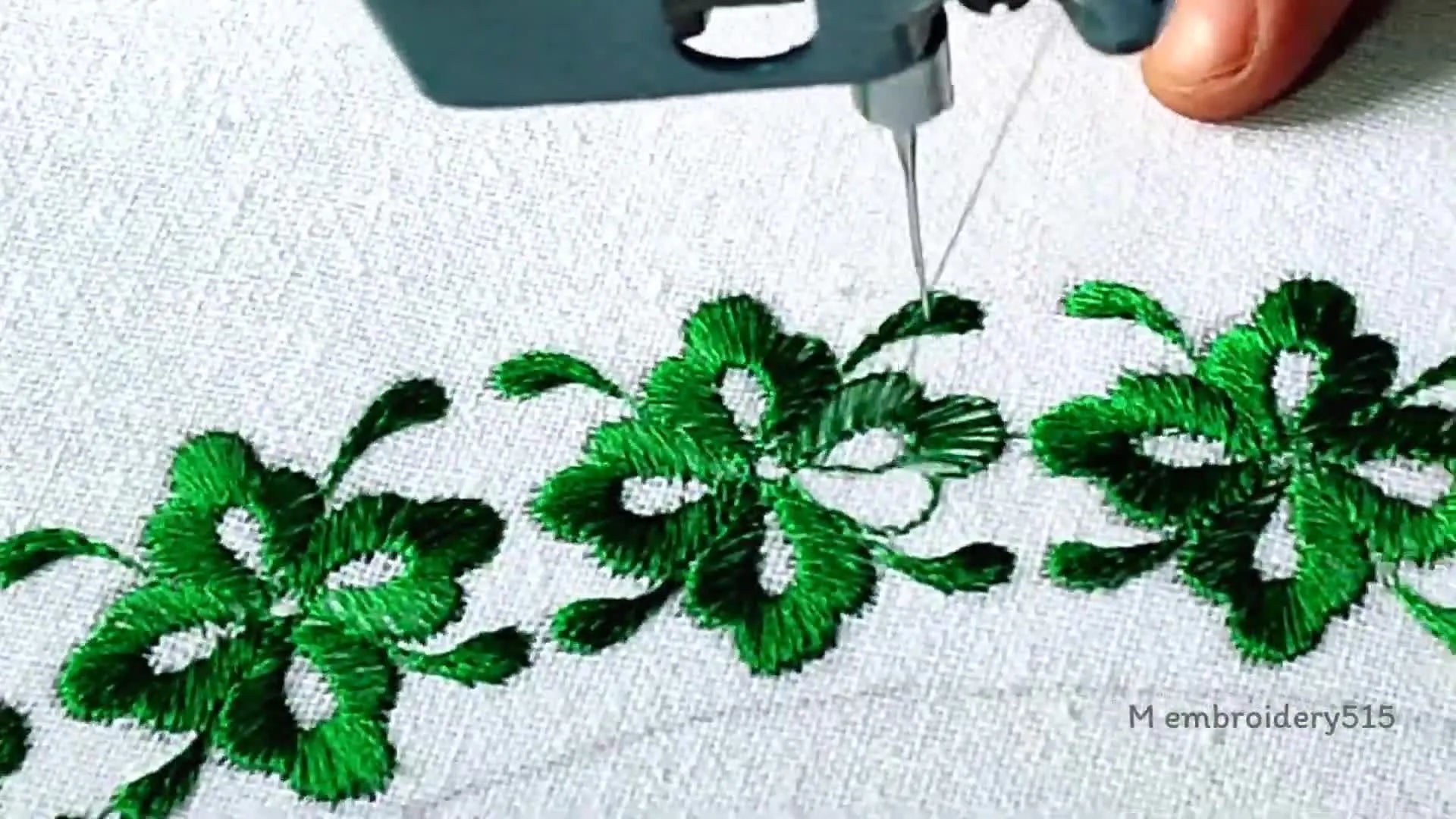 Close-up of a series of completed green floral designs.