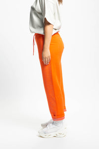 orange nike track pants