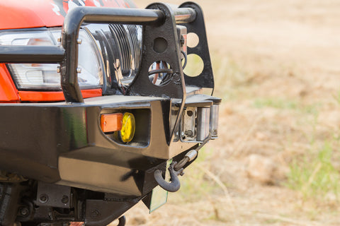 Bull bar 4WD accessory on a red vehicle