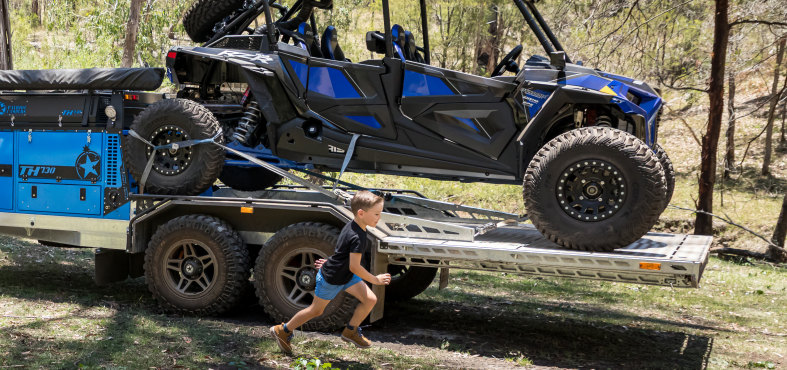 Blue Patriot TH730 Toy Hauler towing an ATV