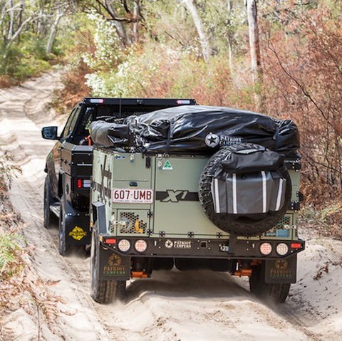 X1 Camper Trailer being towed off-road