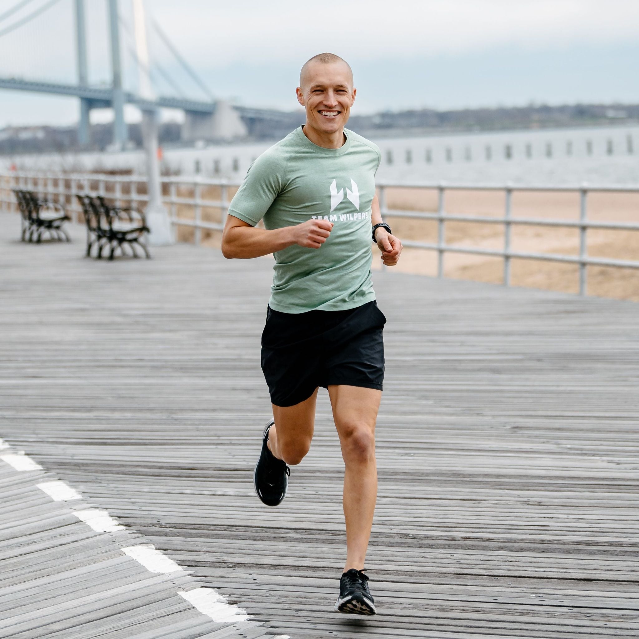 Matt Wilpers jogging on pier