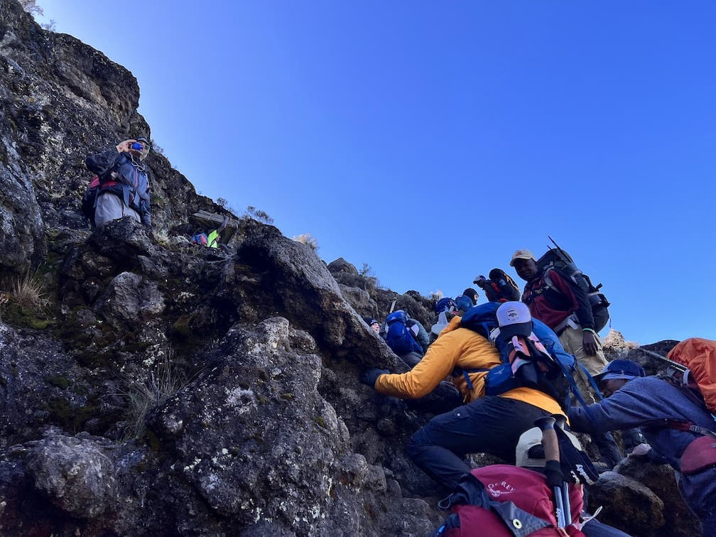 People climbing Mt Kilimanjaro