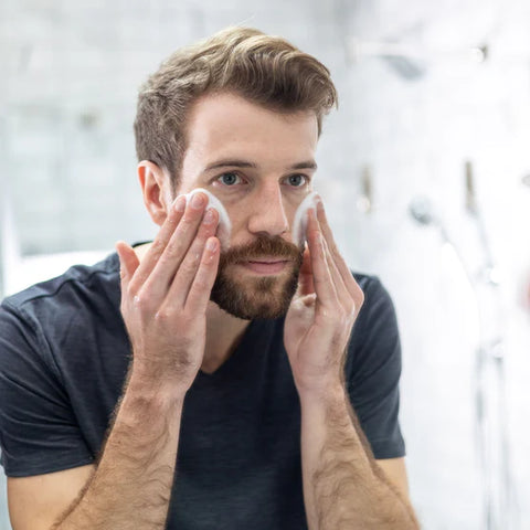 A man washing his face with the Gentle Foaming Face Wash