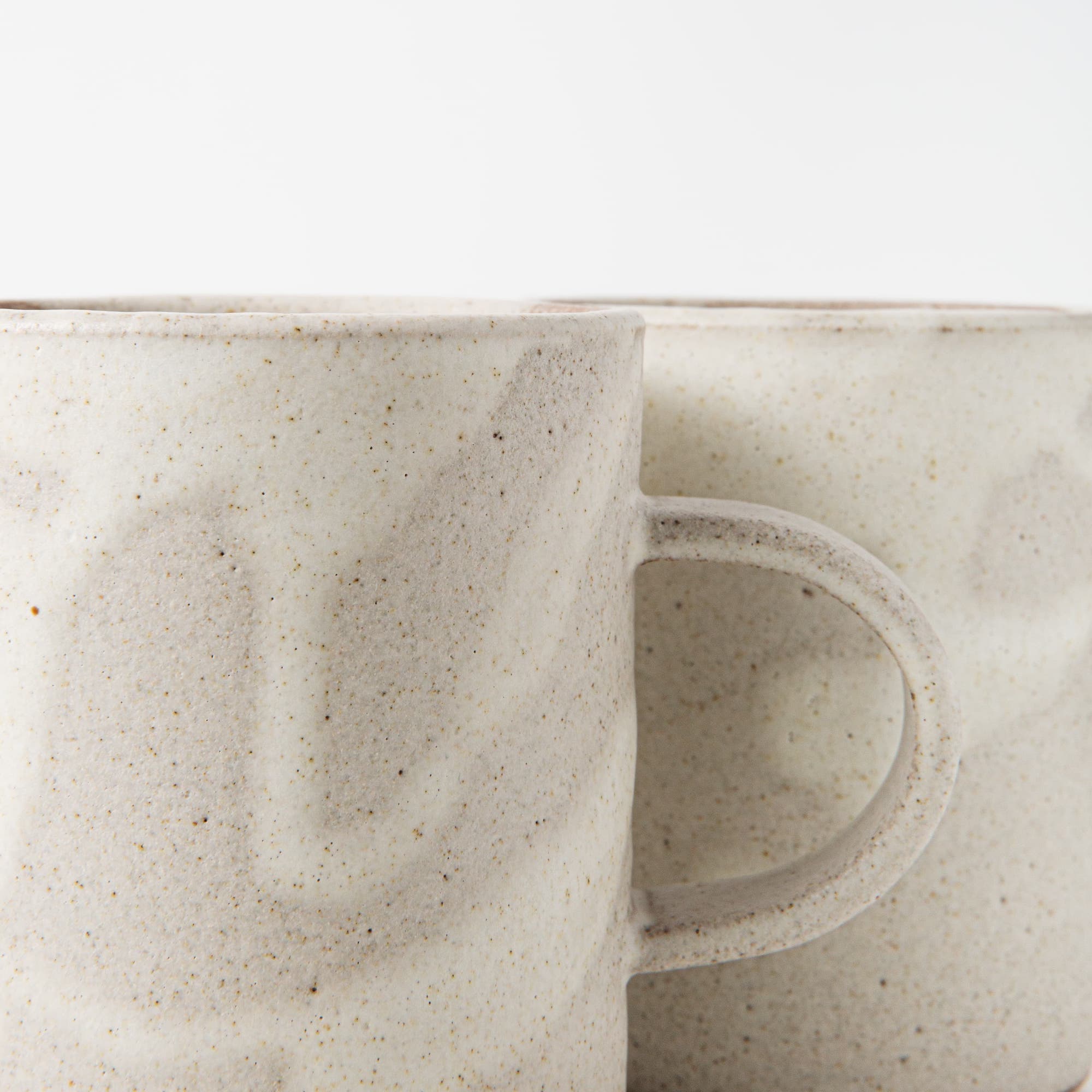 Handmade ceramic mug in white matte glaze by Eren Armitage