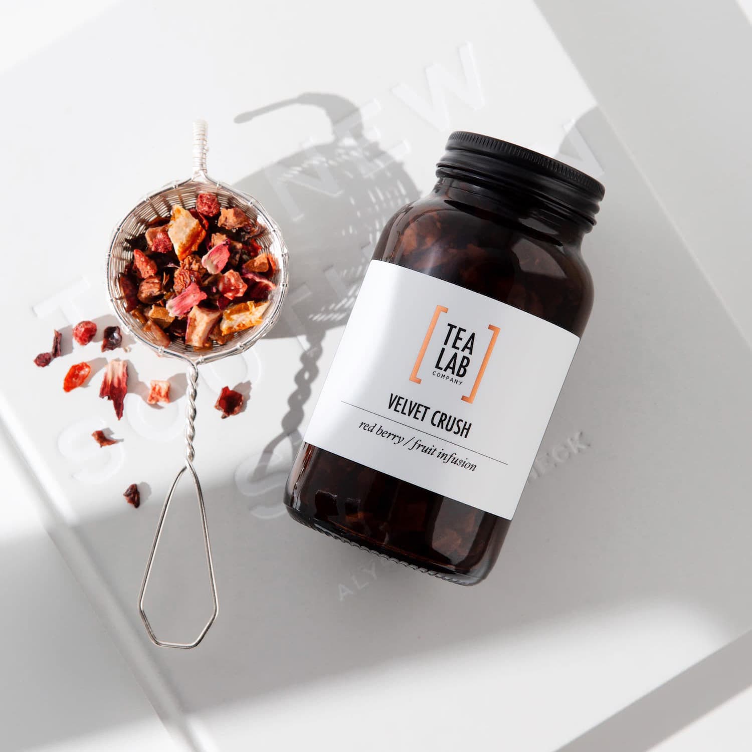Red berry tea in glass amber jar - Tea Lab