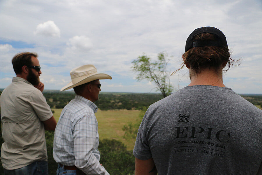 EPIC's head of sourcing, Kirk Blanchard, Chad Lemke, and EPIC co-founder Taylor Collins take in the view from a bluff on Lemke's property.