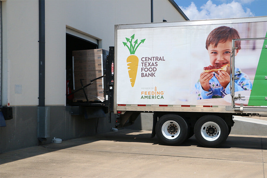 Boxes of EPIC product being loaded into a Central Texas Food Bank Truck