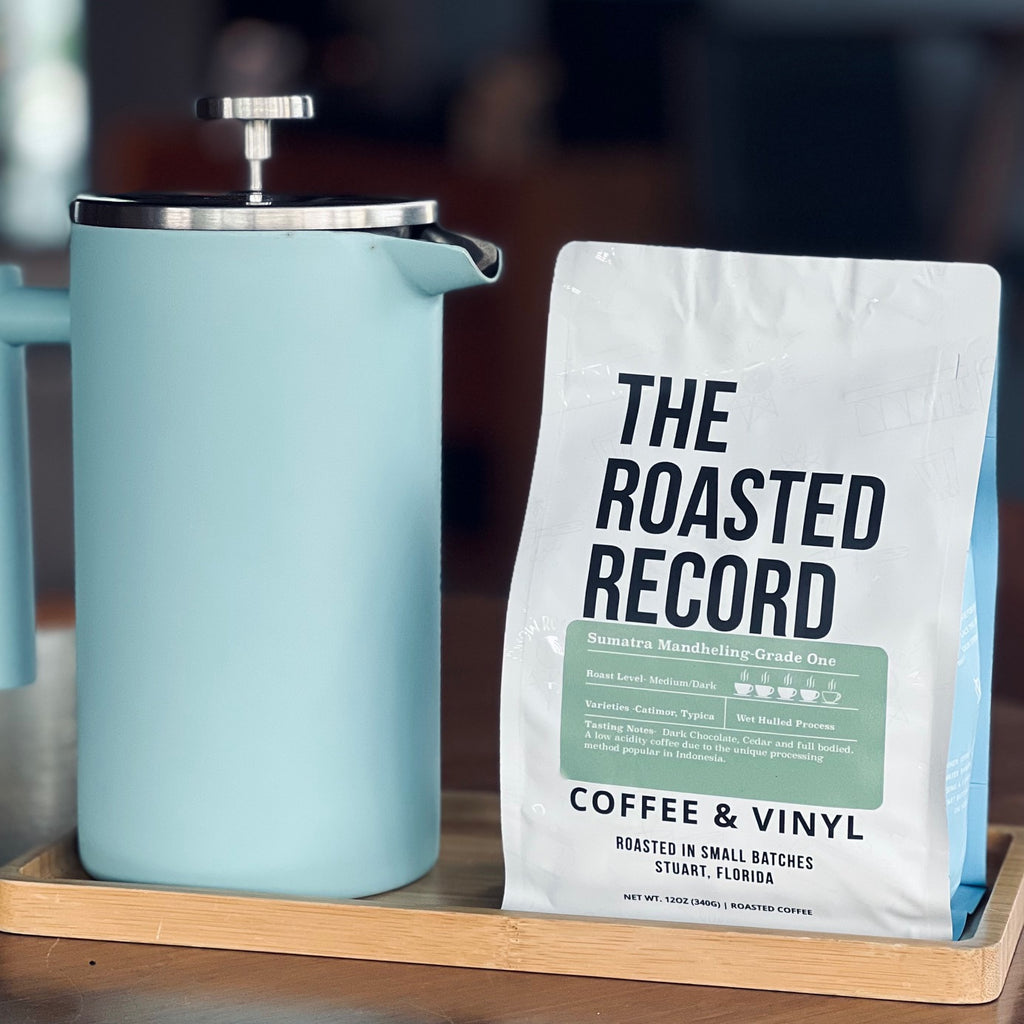 French press with bag of roasted record coffee