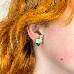 Green Matcha Boba Tea Earrings with crystals on a person's ear