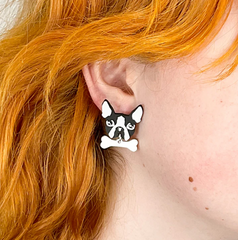 Boston Terrier dog head earrings with a bone dangling from its mouth.