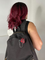 Anatomical heart brooch on a black backpack