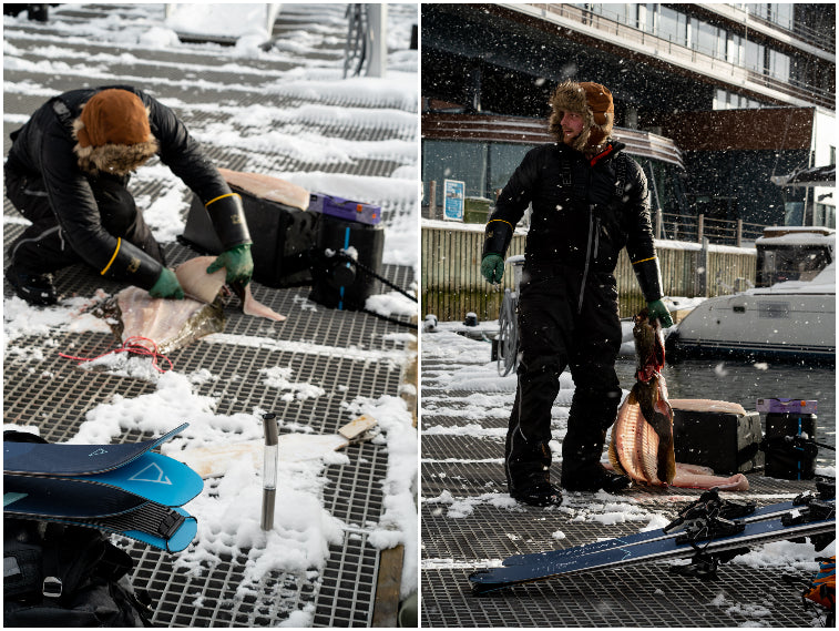 Max on the docks of the harbor of Tromsø with the big halibut he caught.