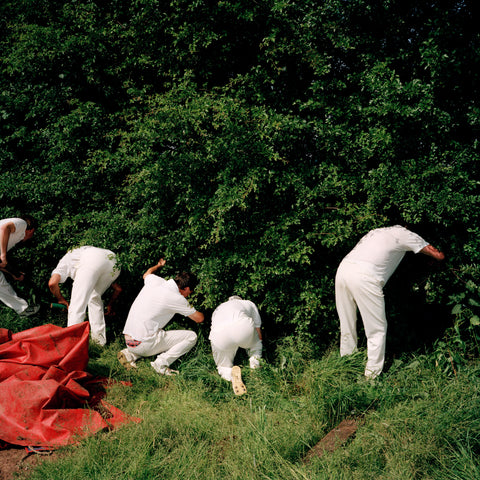 Cricket Players looking for cricket ball, 1992, featured in A Year in the Life of Chew Stoke Village by Martin Parr