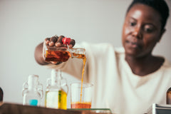 Woman pouring essential oil