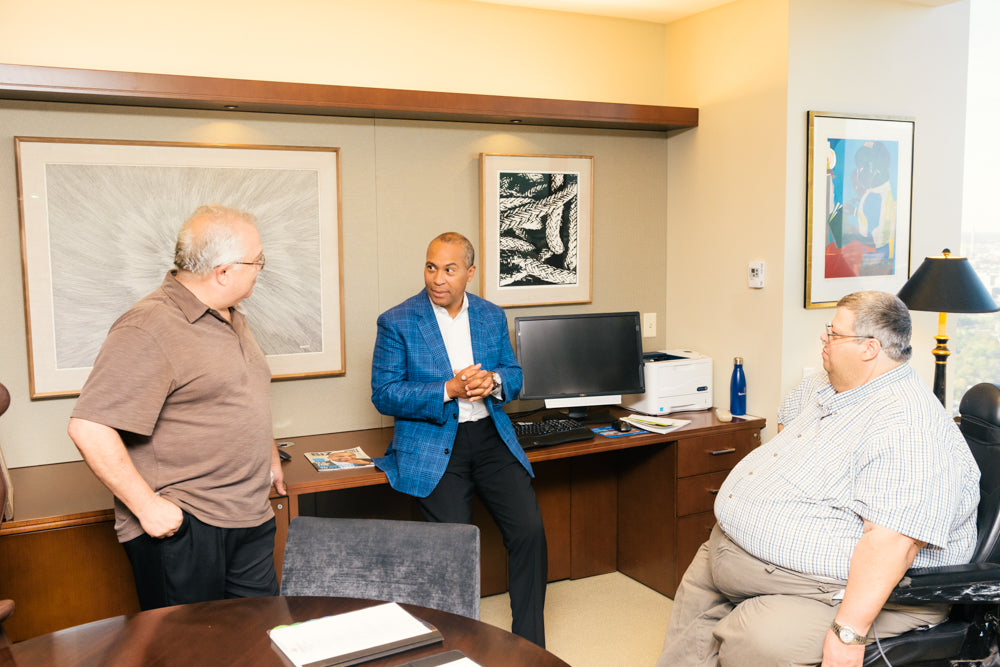 Deval Patrick chats with artists Allen Chamberland and Scott Benner.