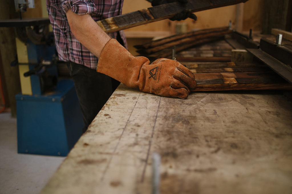 Steam straightening pinot noir barrel staves (The Paper Rain Project Recycled Wine-barrel Art Longboards)