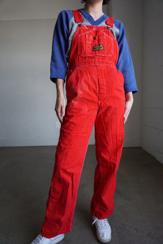 red baggy overalls