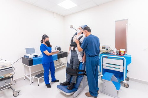 a doctor and nurse treating a patient