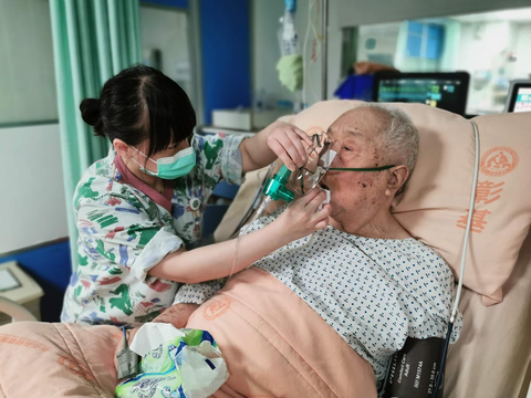 a nurse is taking care of an elderly patient