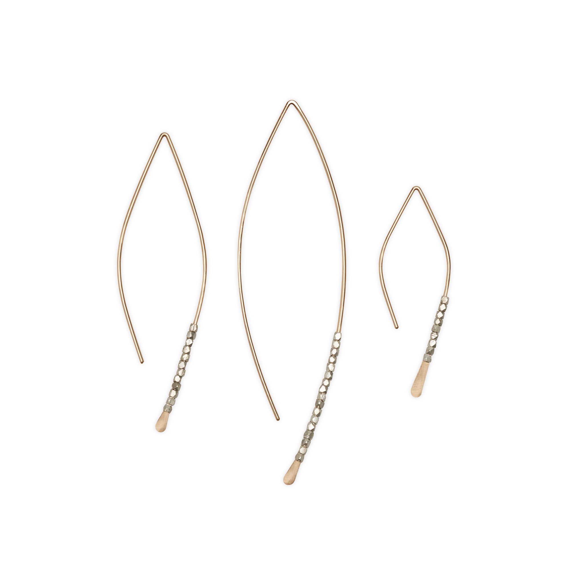 The Bead Crescent Earrings feature a thin, hammered wire adorned with sterling silver beads 