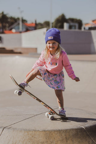 Coco wears the Pink Flowerman Tee & Party Skirt