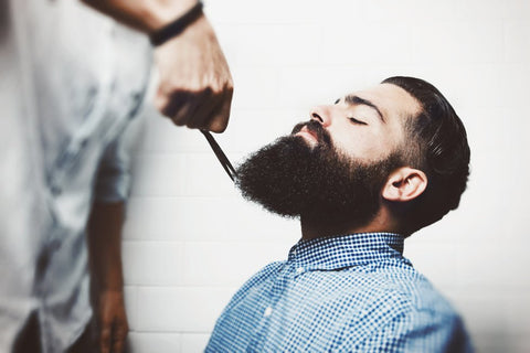 Man Getting his Beard trimmed