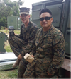 two US Army members displaying their Alpha Coffee