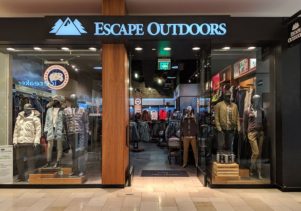 An exterior photo of the Escape Outdoors location at Bellevue Square Mall, showing mannequins in the windows wearing the latest fashions from the premier outdoor brands we carry.