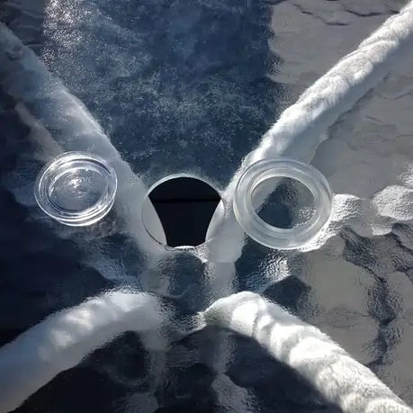 Patio table ring and cap laying on glass table